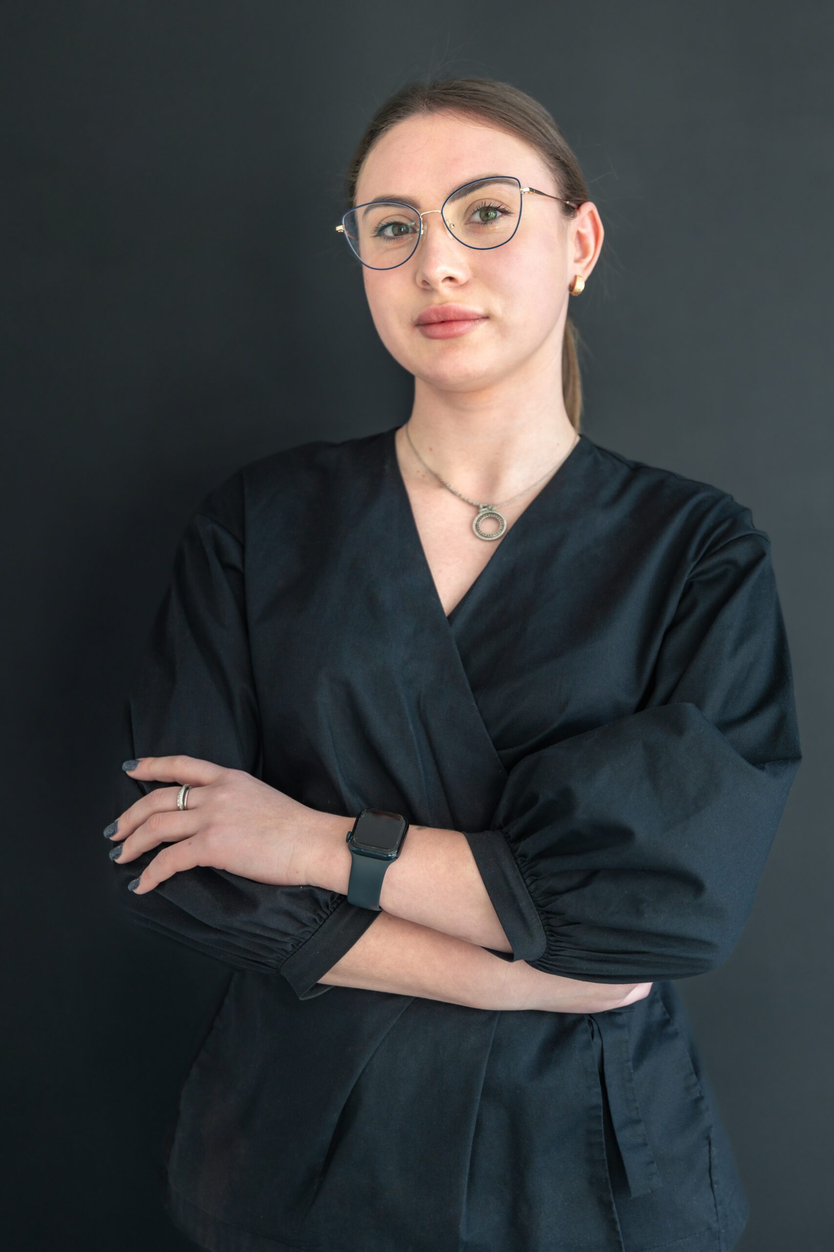 Portrait of a young female dentist. Dentistry concept. Dental treatment. High quality photo. Close-up portrait of a dentist.